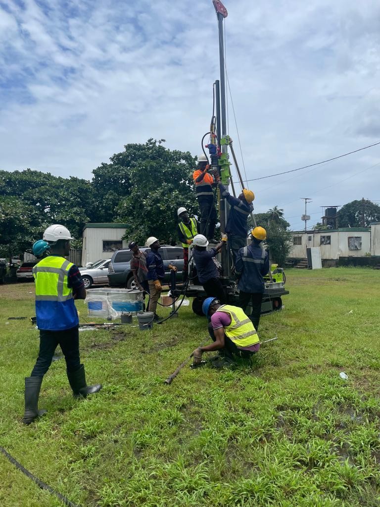 ISC professional team conducting geotechnical drilling operations with safety equipment and expertise
